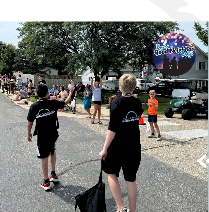 Elias Construction team walking in the Byron Good Neighbor Days parade in Byron, MN